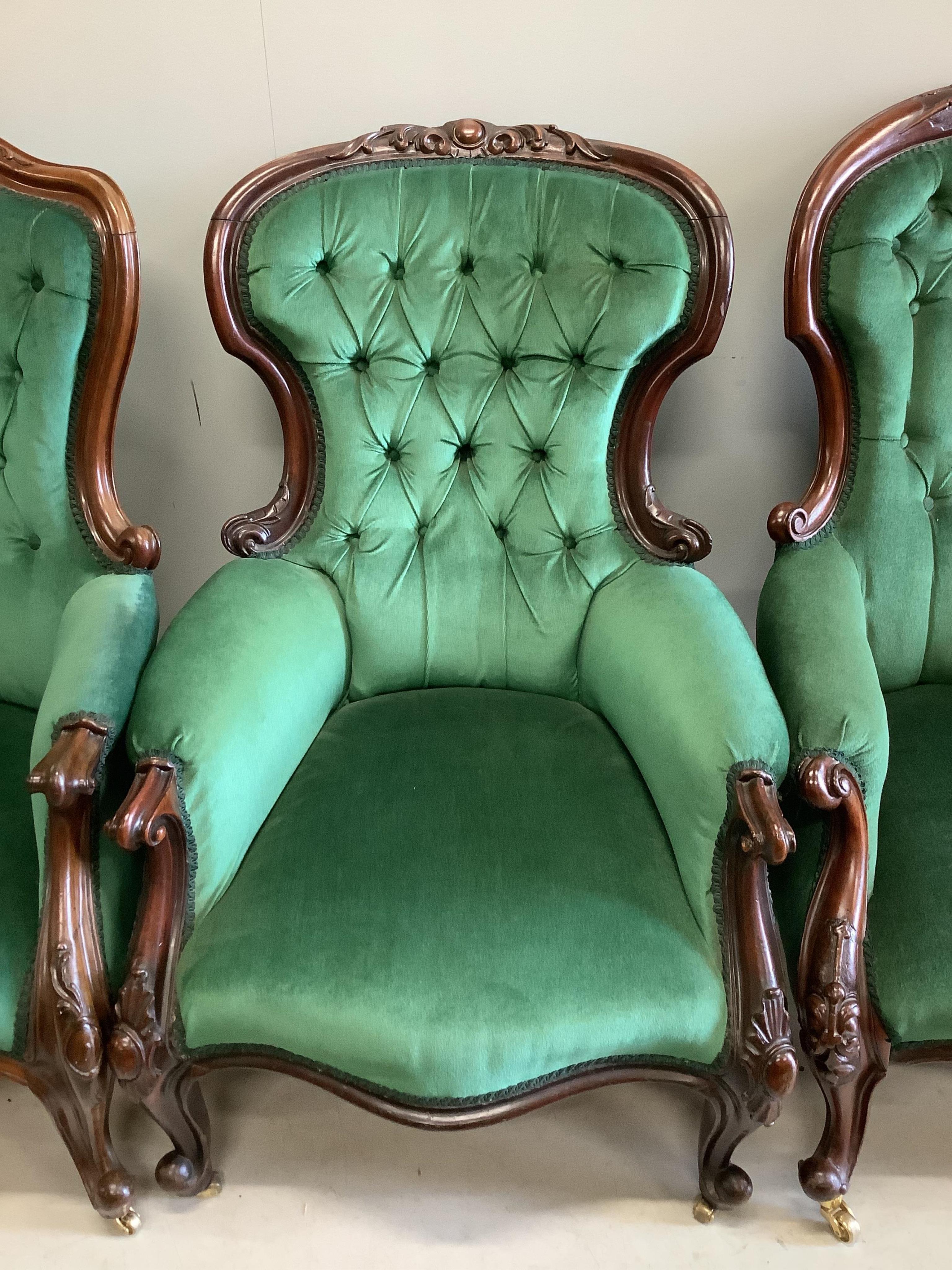 Four Victorian upholstered mahogany spoon back chairs, largest height 110cm. Condition - fair to good